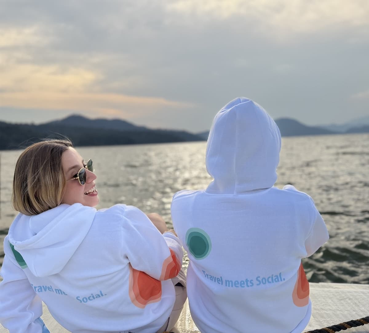 OpenRoom ambassadors wearing branded hoodies by the lake