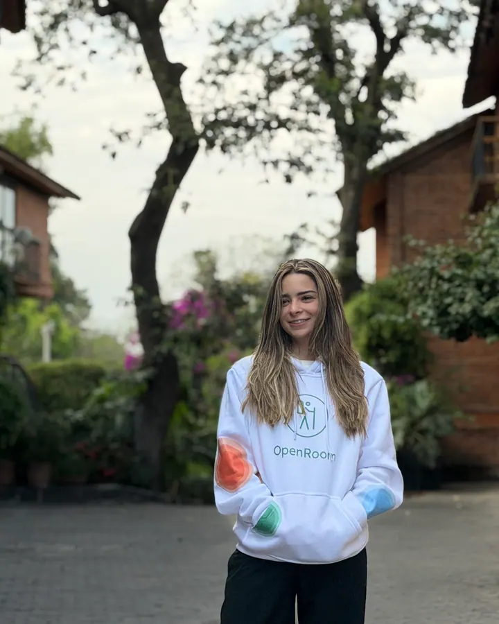 OpenRoom brand ambassador smiling in a garden